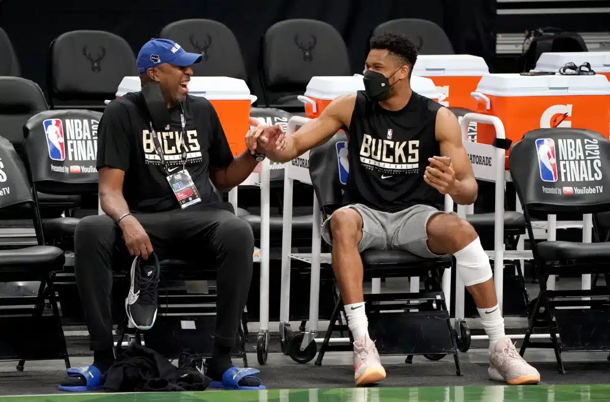 Milwaukee Bucks assistant coach Vin Baker jokes with forward Giannis Antetokounmpo during a July practice at Fiserv Forum. Baker is opening an addiction treatment and recovery center on Milwaukee's northwest side.